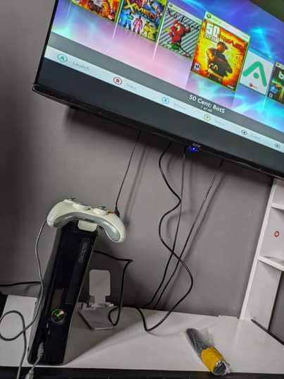 A picture of Xbox 360 2 controllers 20 Games 200k Location kimara kona