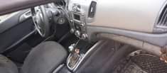 A picture of Kia Cerato 2012 with a bad gear Ac working Sound