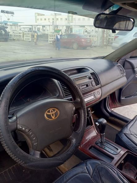 A picture of Toyota Camry 06 Engine Ac gear Interior under neat Body