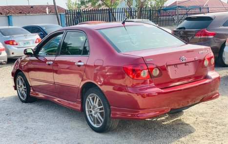 A picture of RED An Extremely Clean Used Toyota Corolla 2004 Model With
