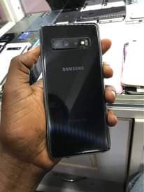 A picture of At 300k Ugs Samsung s10 slightly cracked with a dot