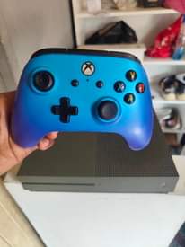 A picture of Xbox 1s storage 1 TB Games 4 Fifa 23 Need