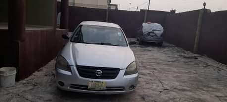 A picture of DELAY IS DANGEROUS 2004 NISSAN ALTIMA Painted on first body
