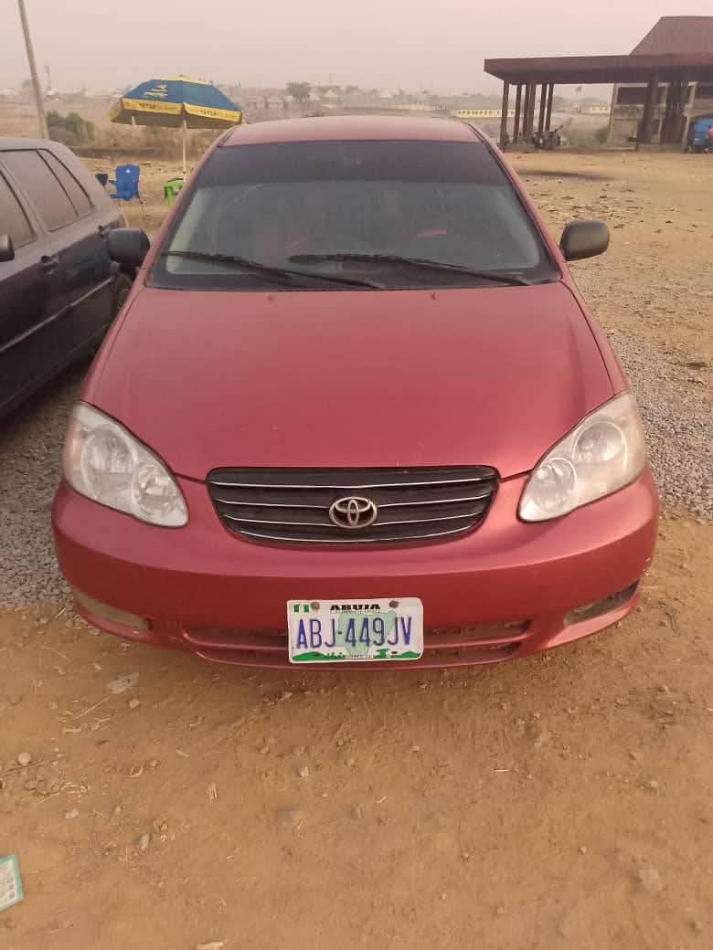 A picture of Sharp 2004 Corolla engine and gear perfect AC needs attention