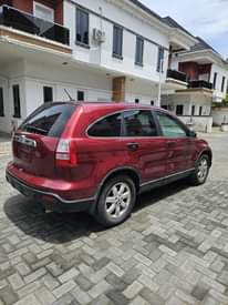 A picture of A Red Honda CR V Jeep.