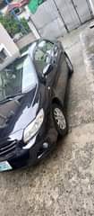 A picture of 2010 MODEL COROLLA NEATLY SPRAYED