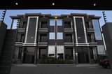 A picture of  Apartment Block For Sale Location Kyanja Kungu on tarmac.