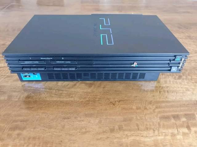 A picture of New ps2 new pads and game of your choice at
