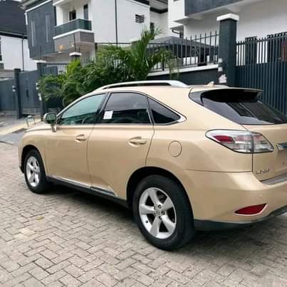 A picture of DIRECT TOKUNBO 2010 LEXUS RX350 FULL OPTION. Gold on cream
