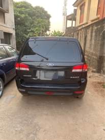A picture of Ford Escape 2010 Japanese specs four plugs very very low