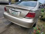 A picture of DISTRSS SALE 2004 model toyota camry LE BIG DADDY painted
