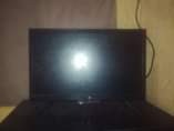 A picture of Laptop and flat screen tv