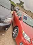 A picture of Red Toyota Corolla for sale tokunbo standard