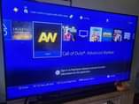 A picture of PS4 WITH 5 GAMES 1 CONTROL AND 2 MIC