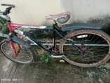 A picture of Used bicycle with 2 bad tyres ND chain 