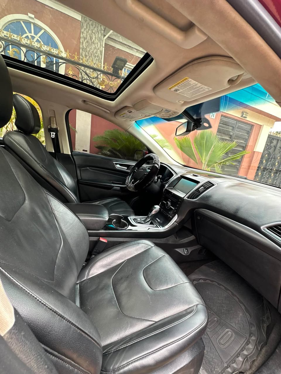 A picture of 2016 Ford edge titanium with 4plug engine