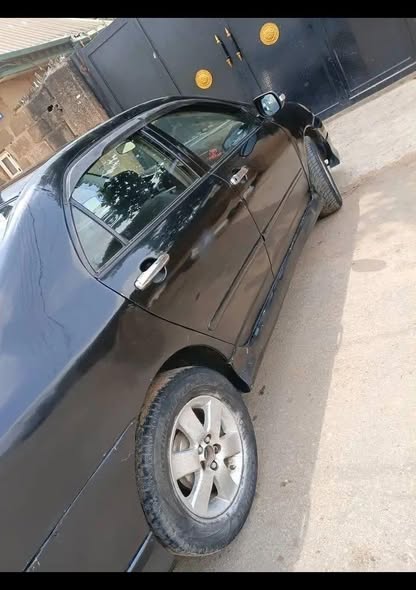 A picture of AWOOF DEALERS DEAL TOYOTA COROLLA 04