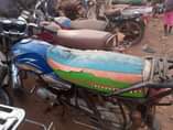 A picture of Bajaj boxer and TVs