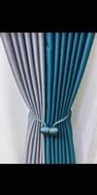 A picture of Curtains and rod s