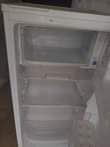 A picture of Samsung single door fridge with a big freezer with a