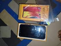 A picture of Neatly use infinix hot 7 pro with cartoon and receipt