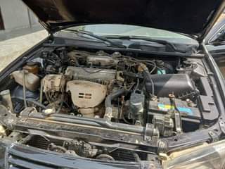 A picture of Toyota Camry tiny light with clean engine gear and AC