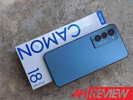 A picture of A very clean phone with the original accessories and also