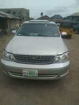 A picture of 2003 Toyota Avalon dashboard first body 1 year old the