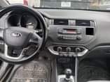 A picture of 2015 COMPANY USED KIA RIO MANUAL DRIVE LOW MILEAGE FIRST