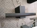 A picture of Sony soundbar with remote