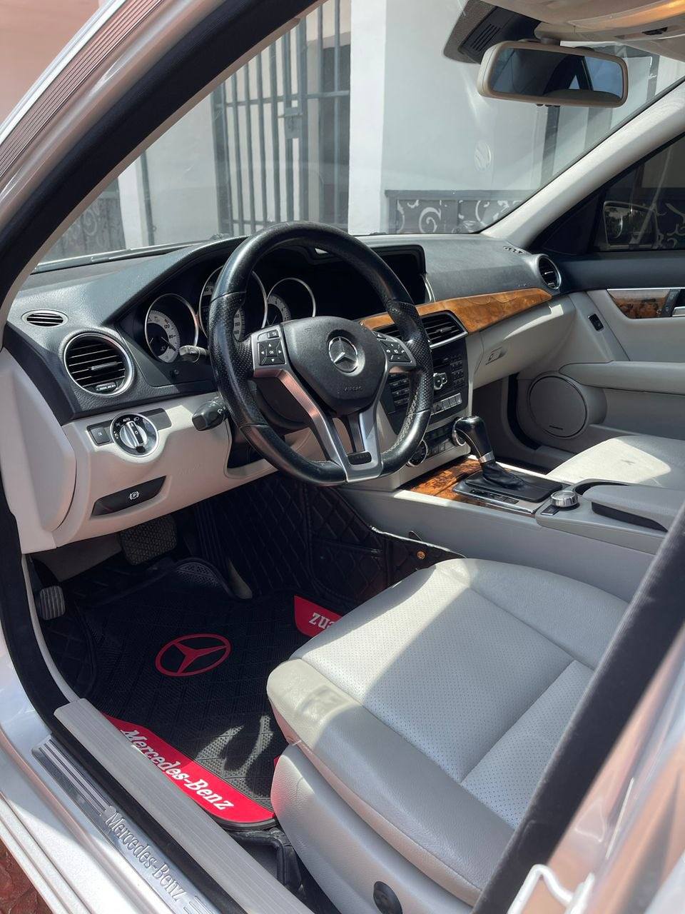 A picture of 2012 Mercedes Benz C250 super clean AC chilling everything intact.