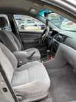 A picture of Registered Toyota Corolla 2004 model interior Crystal clean painted Suspensions