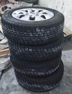 A picture of New tyre with rim wheelcape size 15