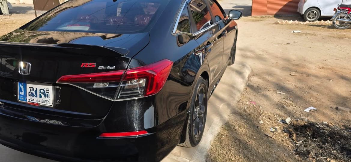 A picture of HONDa Civic Oriel 2025 Black with burgundy