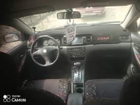 A picture of Belgium grade 2004 model Toyota Corolla with everything sounds like