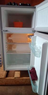 A picture of ADH fridge double door one months used everything thing is