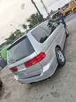 A picture of URGENT SALE Foreign used 02 Honda Odyssey fabrics 3rows power