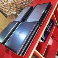 A picture of Five dell laptops one i7 and four i5 all 320gb