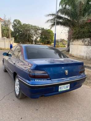 A picture of Very clean 406 manual with complete original papers and duty
