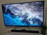 A picture of 55 inch Toshiba smart tv Samsung soundbar en hp laptop