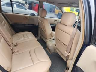 A picture of TOKUBO STANDARD USED TOYOTA HIGHLANDER UPGRADED TO 2005 DIRECT OWNER