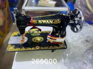 A picture of Sewing machines complete set with the stand