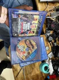 A picture of PS5 and PS4 Game CDs