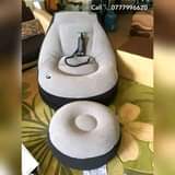 A picture of Intex inflatable air sofas with a foot rest and a
