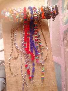 A picture of Necklace and hands beads