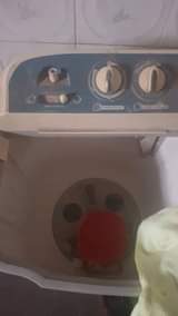 A picture of LG washing machine and Honda 3kva generator