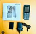 A picture of Nokia 106 full box kwa elfu 27 tuu jumla 2