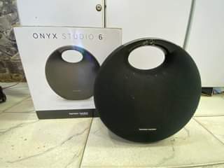 A picture of Harman Kardon onyx studio 6 Bluetooth rechargeable speaker slightly used