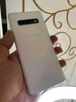 A picture of Samsung galaxy s10 plus with dot