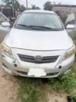 A picture of Corolla 2010 for sale Body work needed painting precisely Engine